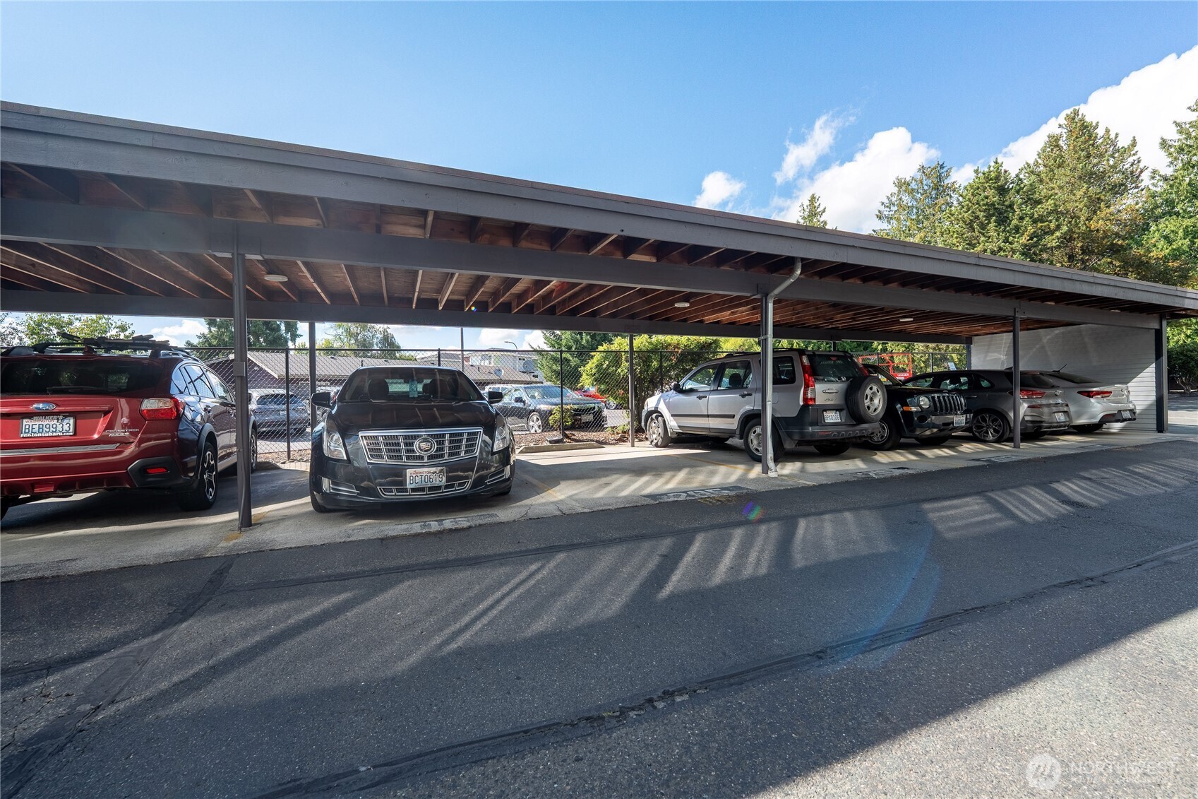 1175 Harrington Place Northeast, Unit 205 Renton, WA 98056 - Photo 21 of 30 a view of parking space with cars