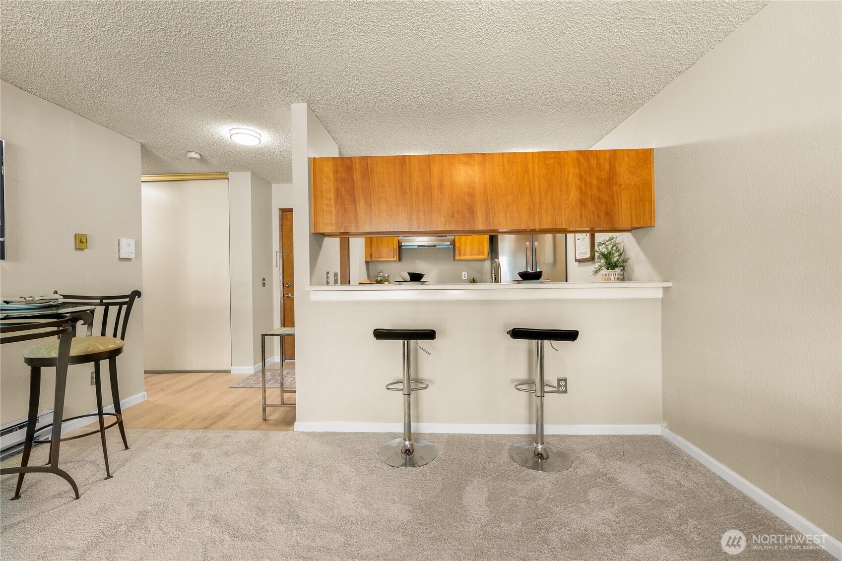 1175 Harrington Place Northeast, Unit 205 Renton, WA 98056 - Photo 8 of 30 a view of a kitchen with table and chair