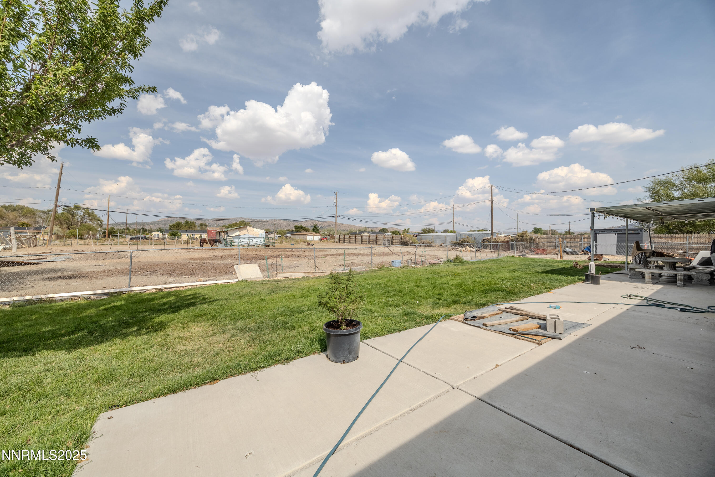 11605 Lemmon Drive Reno, NV 89506 - Photo 12 of 18 a view of a street with a big yard