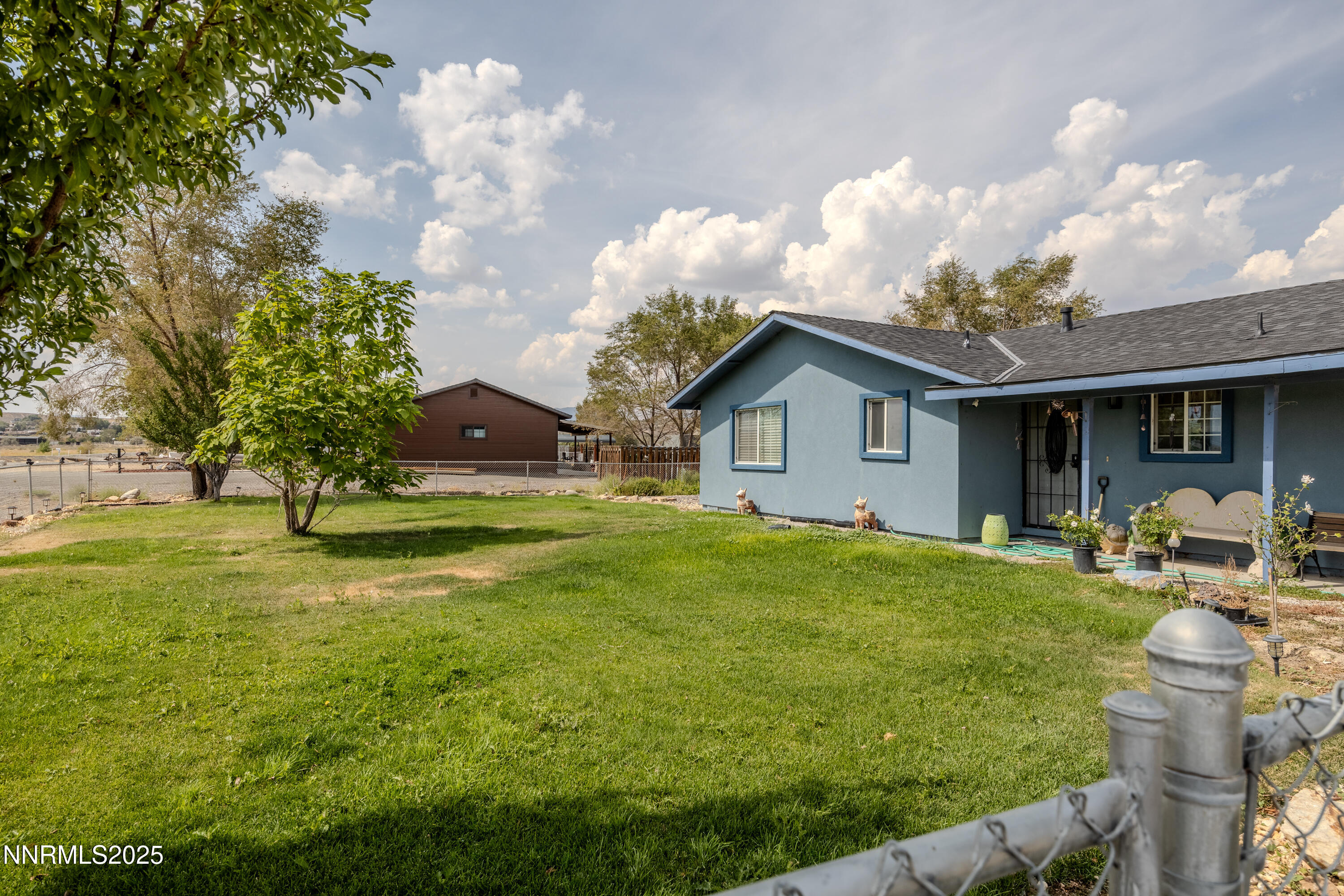 11605 Lemmon Drive Reno, NV 89506 - Photo 14 of 18 a front view of a house with garden
