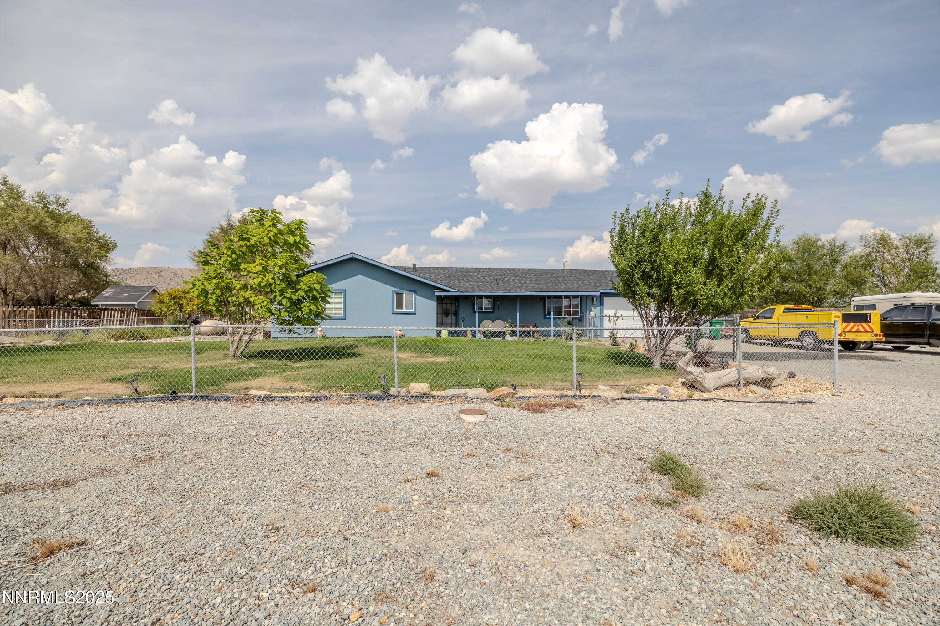 11605 Lemmon Drive Reno, NV 89506 - Photo 17 of 18 a view of a house with a yard and a fountain
