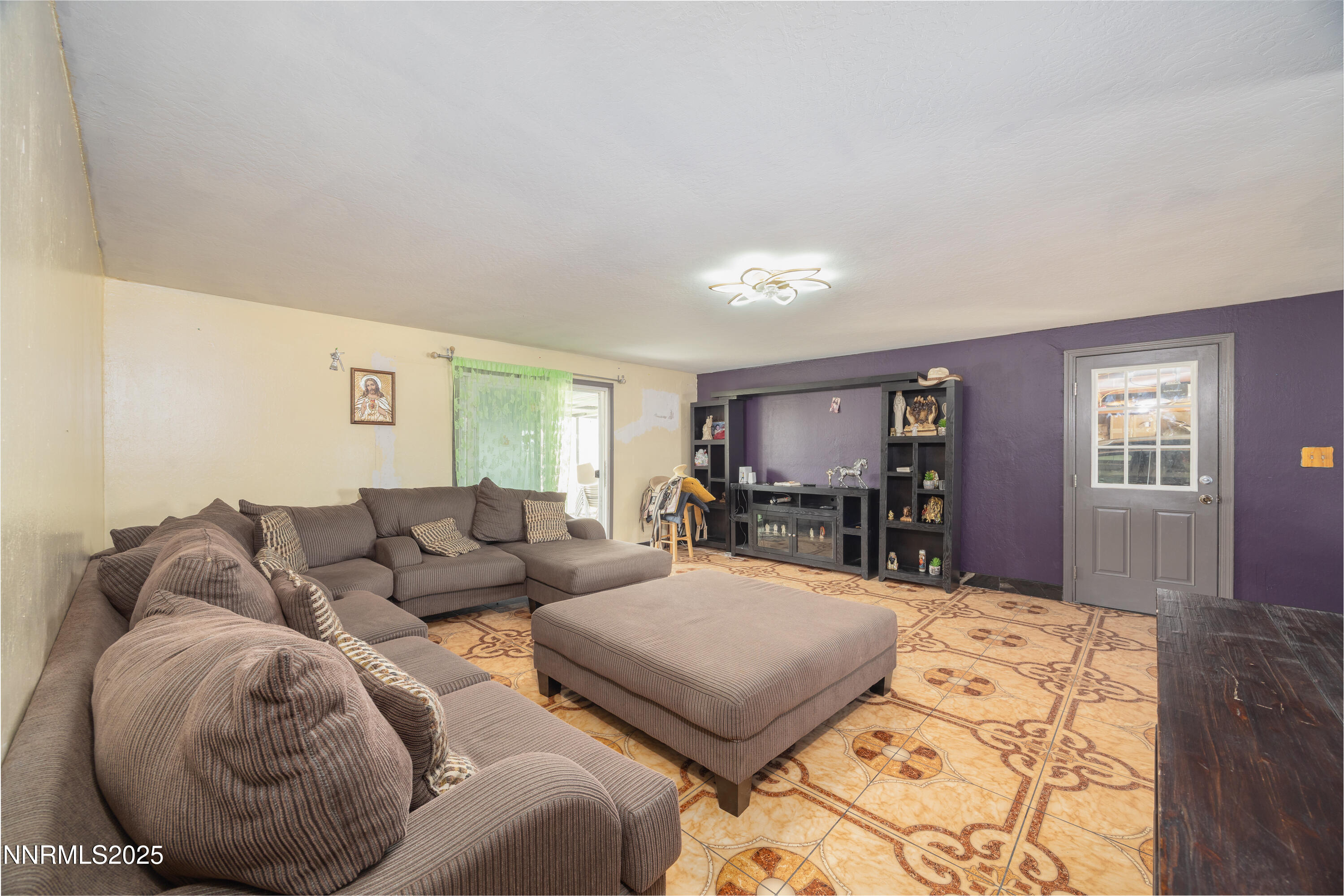 11605 Lemmon Drive Reno, NV 89506 - Photo 5 of 18 a living room with furniture and a flat screen tv