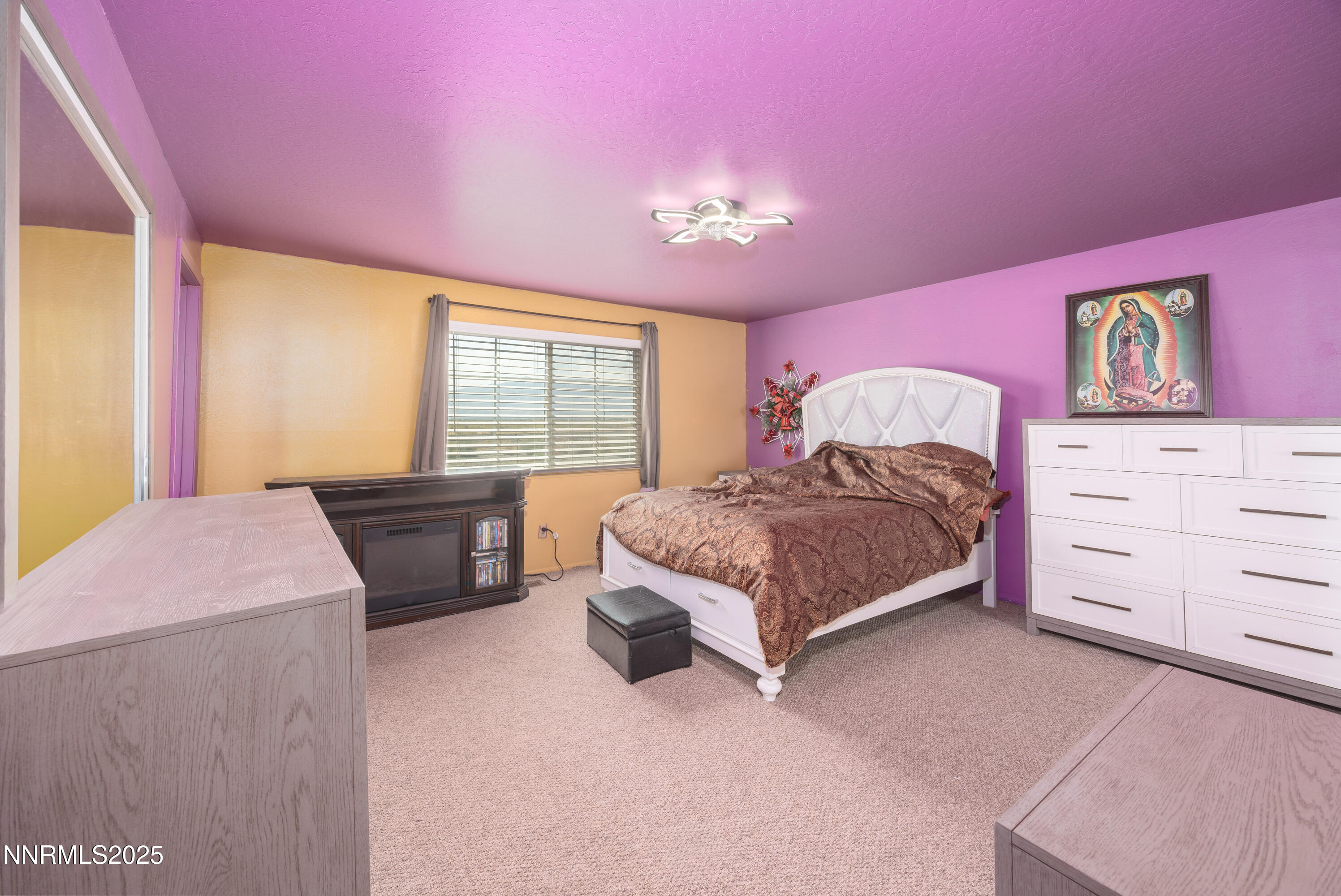 11605 Lemmon Drive Reno, NV 89506 - Photo 6 of 18 a spacious bedroom with a bed and a dresser
