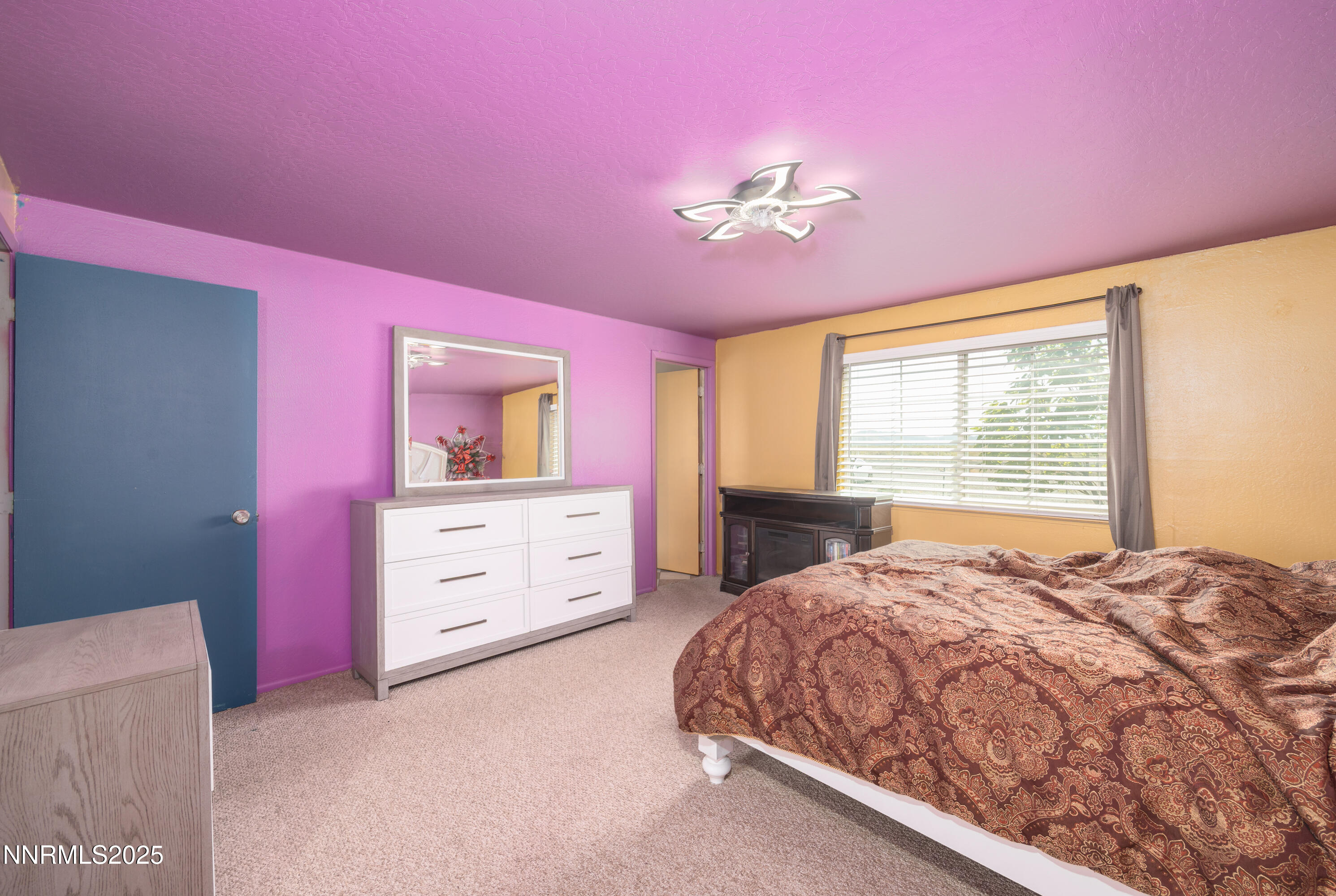 11605 Lemmon Drive Reno, NV 89506 - Photo 7 of 18 a bedroom with a bed and a dresser