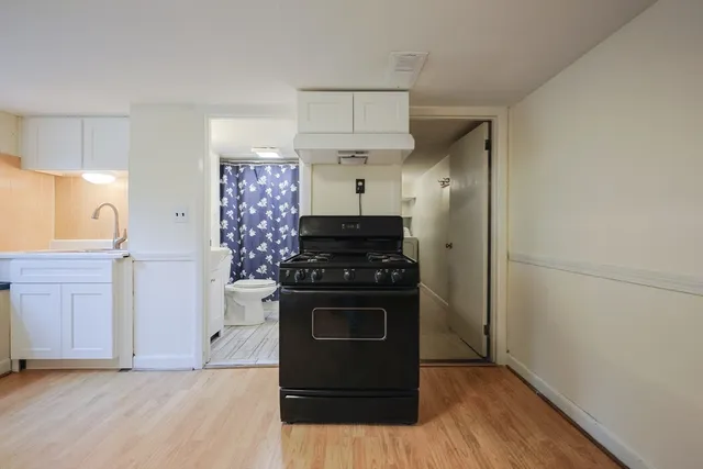 a kitchen with stainless steel appliances a stove and a refrigerator