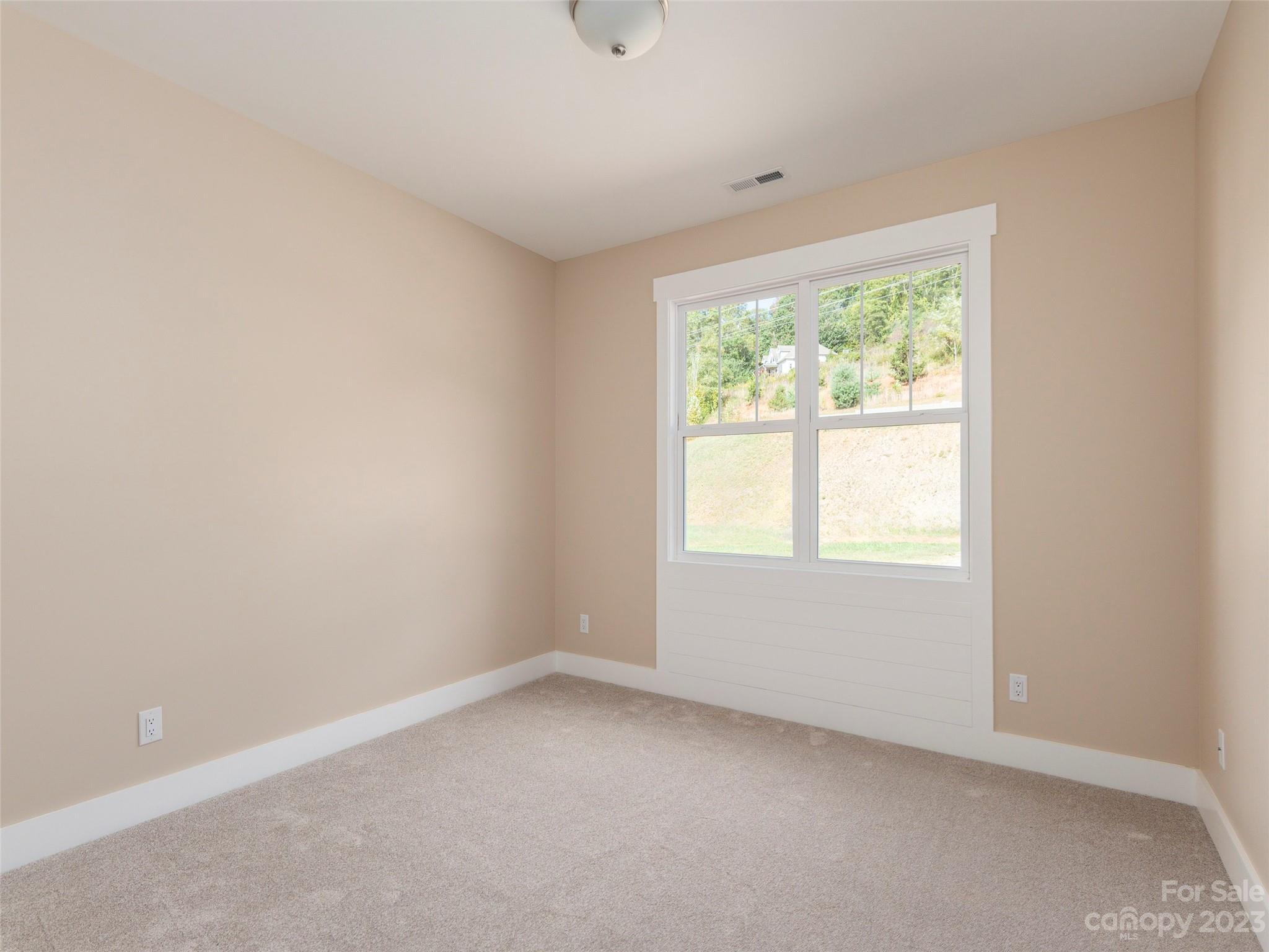 25 Heartleaf Circle Arden, NC 28704 - Photo 14 of 16 an empty room with a window
