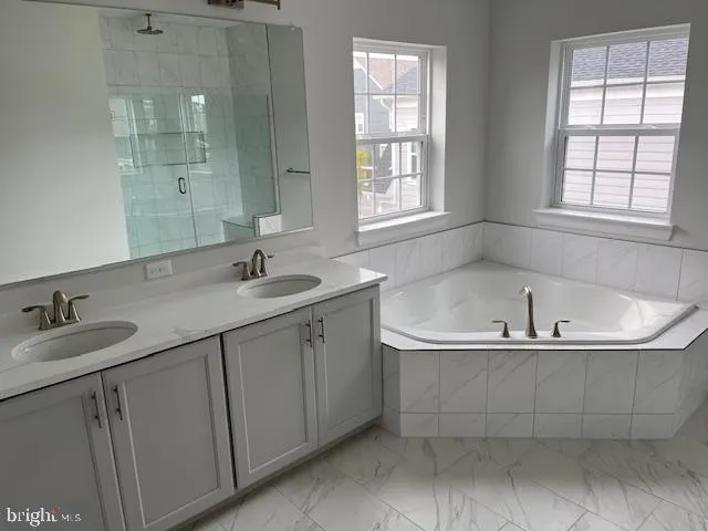 a bathroom with sink and window