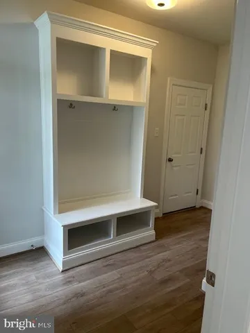 a view of front door with wooden floor