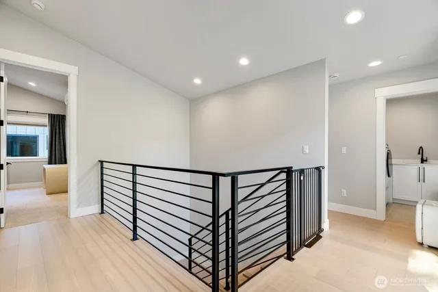 a view of a hallway with seating area