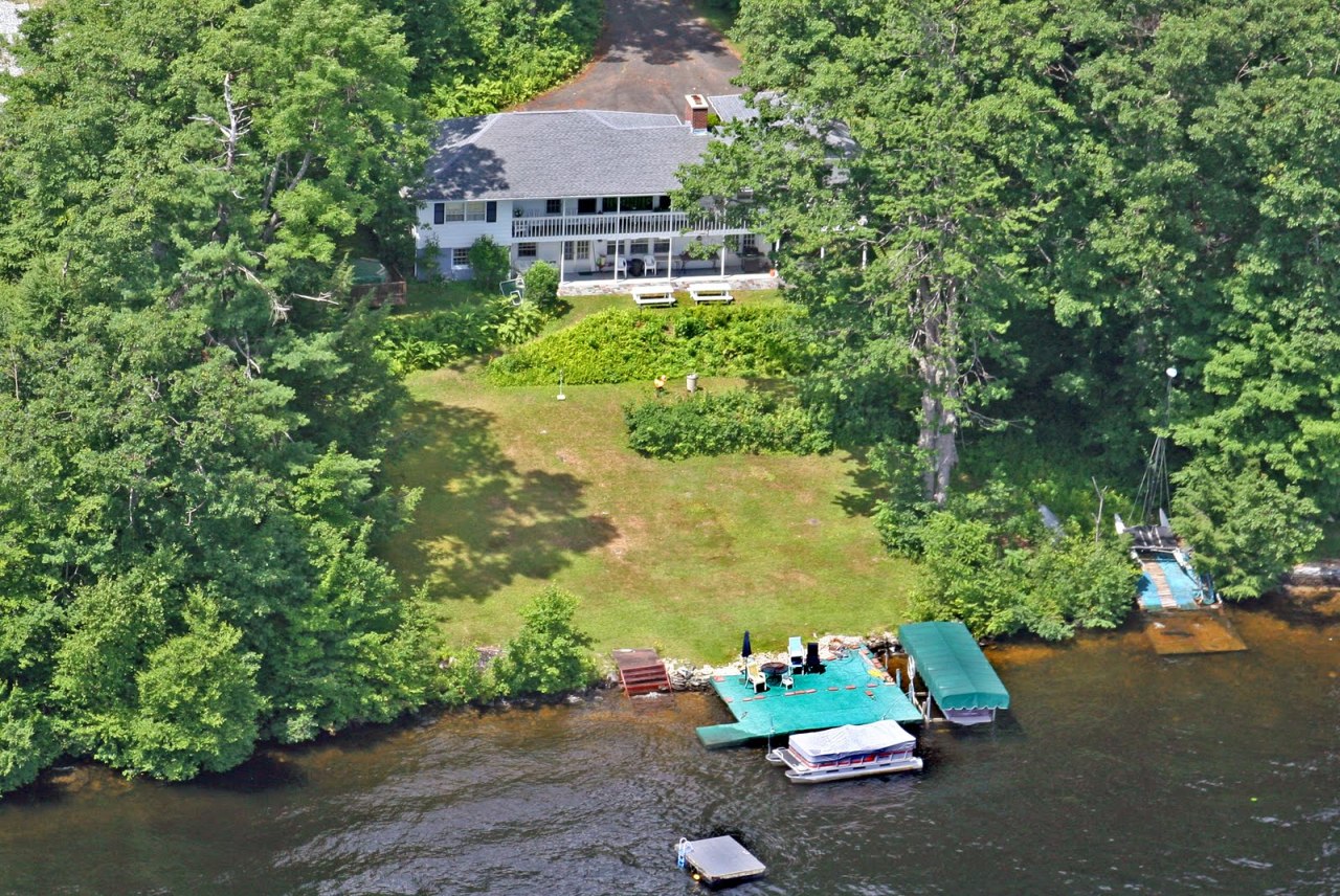 427 Pine Road Otis, MA 01029 - Photo 1 of 30 an aerial view of a house with a yard and lake view