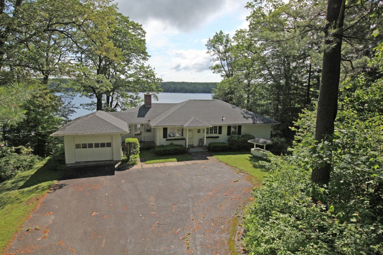 427 Pine Road Otis, MA 01029 - Photo 2 of 30 a front view of a house with a garden