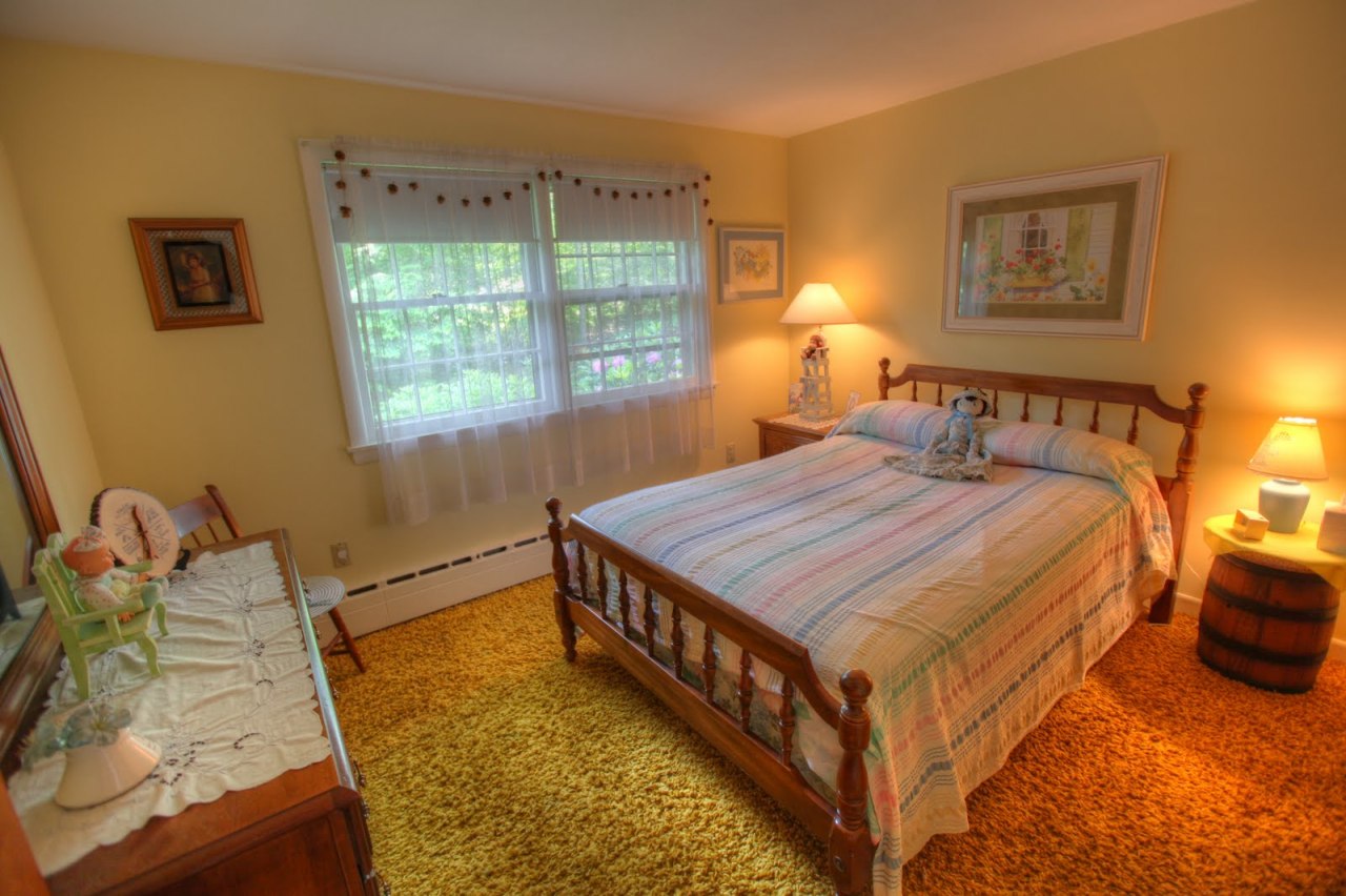 427 Pine Road Otis, MA 01029 - Photo 15 of 30 a bedroom with a bed and window