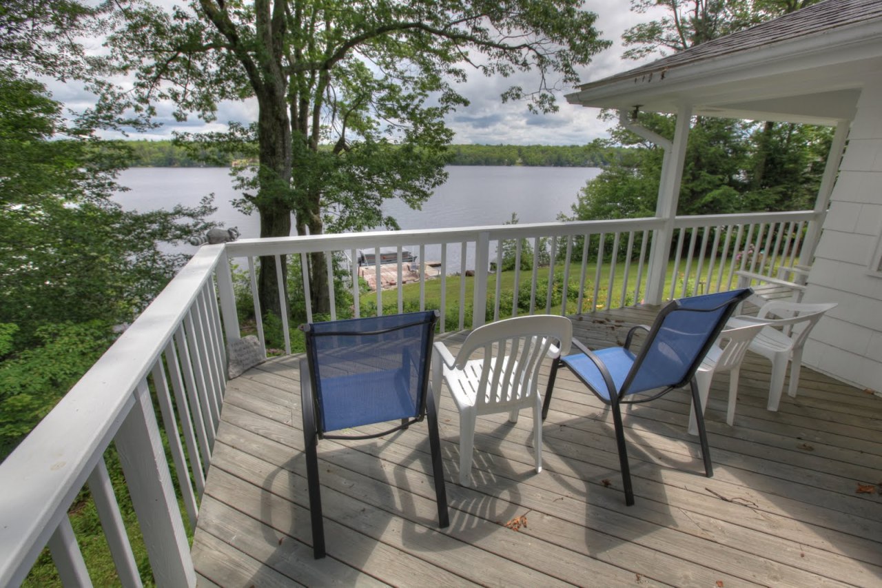 427 Pine Road Otis, MA 01029 - Photo 25 of 30 a view of a deck with two chair and wooden floor