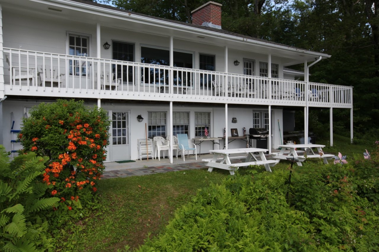 427 Pine Road Otis, MA 01029 - Photo 29 of 30 a front view of house with a garden and patio