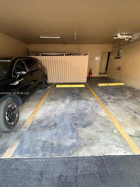 1400 Douglas Road, Unit 14 Coral Gables, FL 33134 - Photo 5 of 19 a view of a car garage
