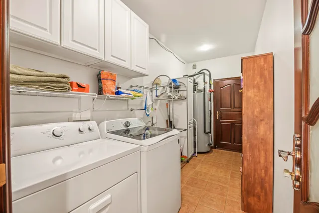 a view of storage and utility room with washer and dryer