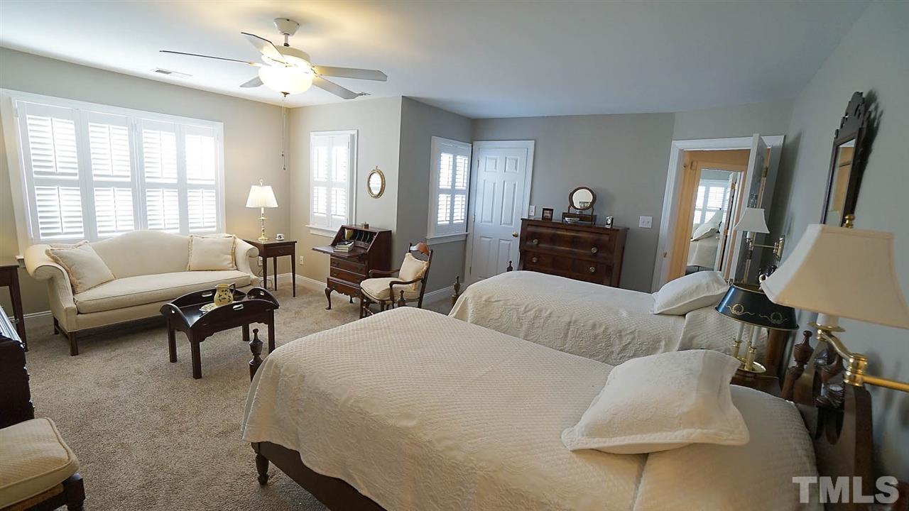 9124 Carrington Ridge Drive Raleigh, NC 27615 - Photo 14 of 24 a living room with furniture and a large window