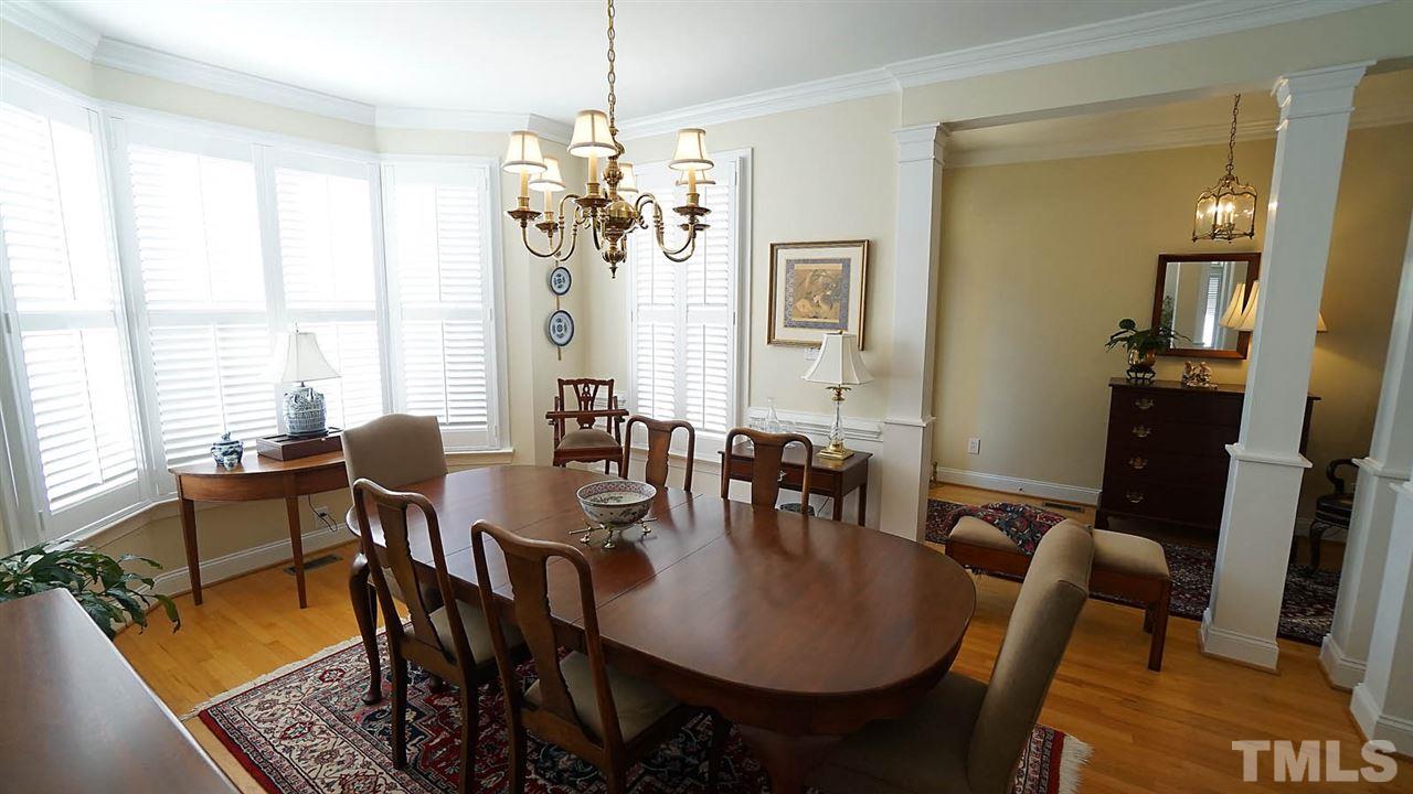 9124 Carrington Ridge Drive Raleigh, NC 27615 - Photo 3 of 24 a view of a a dining room with furniture window and wooden floor