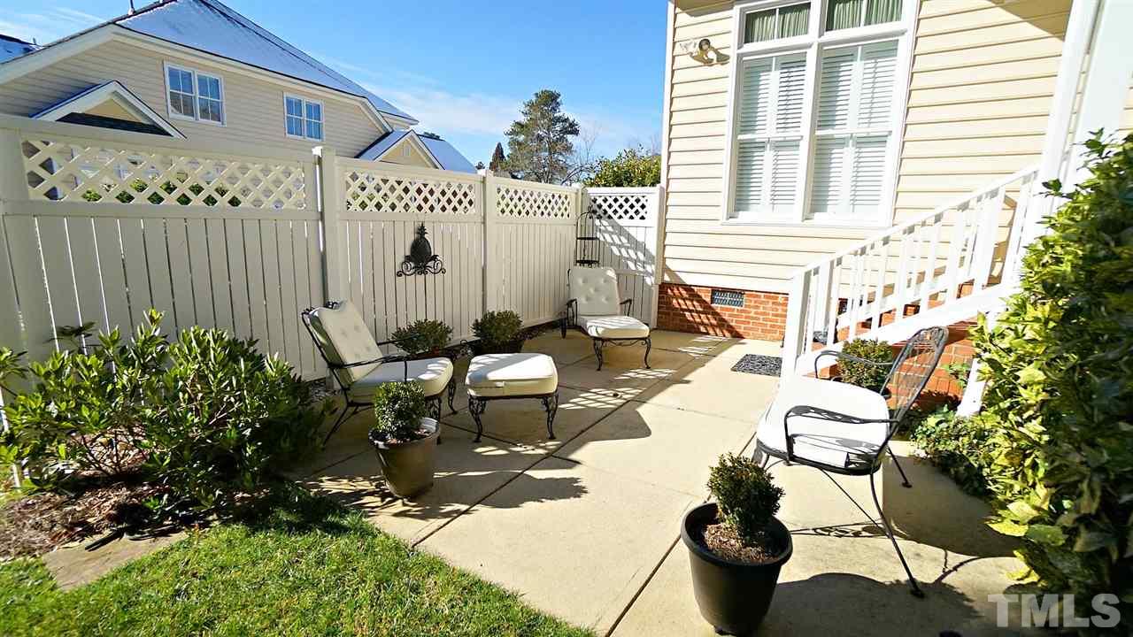 9124 Carrington Ridge Drive Raleigh, NC 27615 - Photo 22 of 24 a view of a chairs and table in backyard