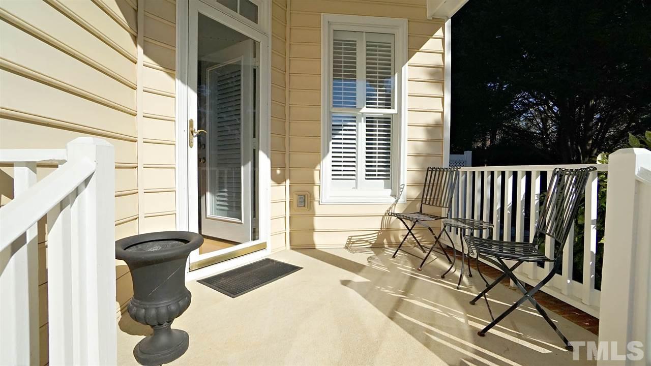 9124 Carrington Ridge Drive Raleigh, NC 27615 - Photo 23 of 24 a bedroom with a bed and a large window
