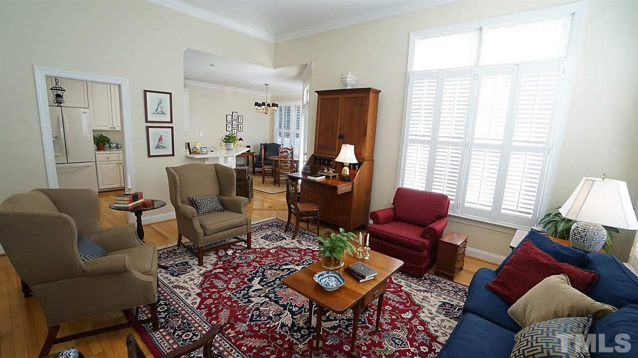 9124 Carrington Ridge Drive Raleigh, NC 27615 - Photo 7 of 24 a living room with furniture and wooden floor