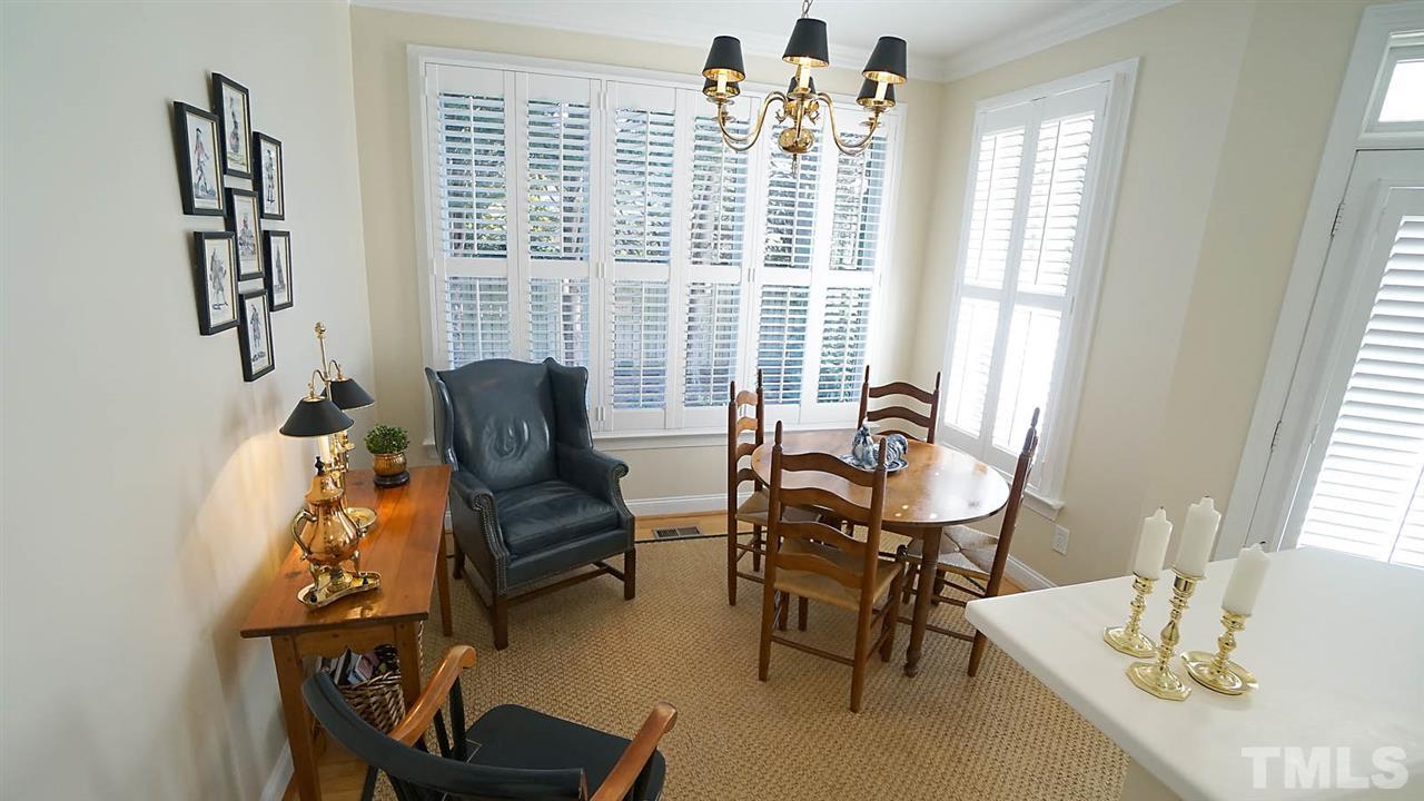 9124 Carrington Ridge Drive Raleigh, NC 27615 - Photo 8 of 24 a view of a livingroom with lounge chair and a large window