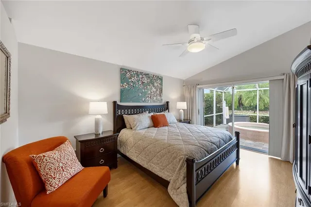 a bedroom with a bed couch and window