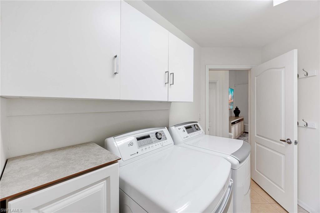 8468 Indian Wells Way Naples, FL 34113 - Photo 26 of 40 a utility room with dryer and washer