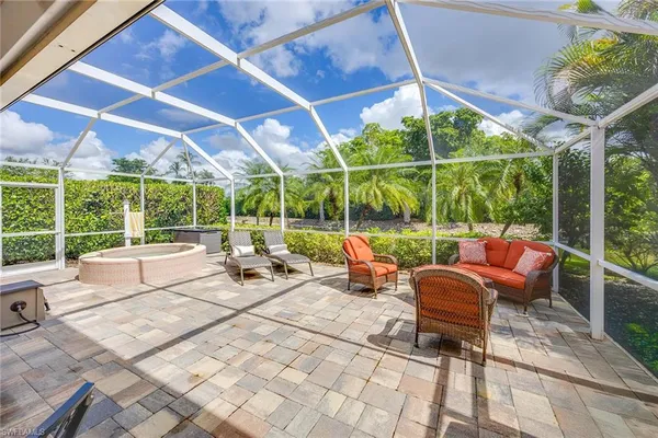 a view of a chairs and table in a patio