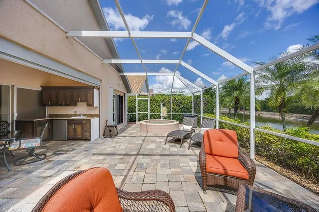 a view of a swimming pool with a patio