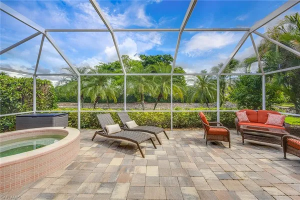 a view of a patio with a table and chairs