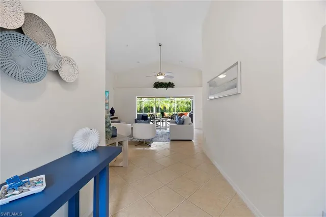 a hallway with a table and a couch