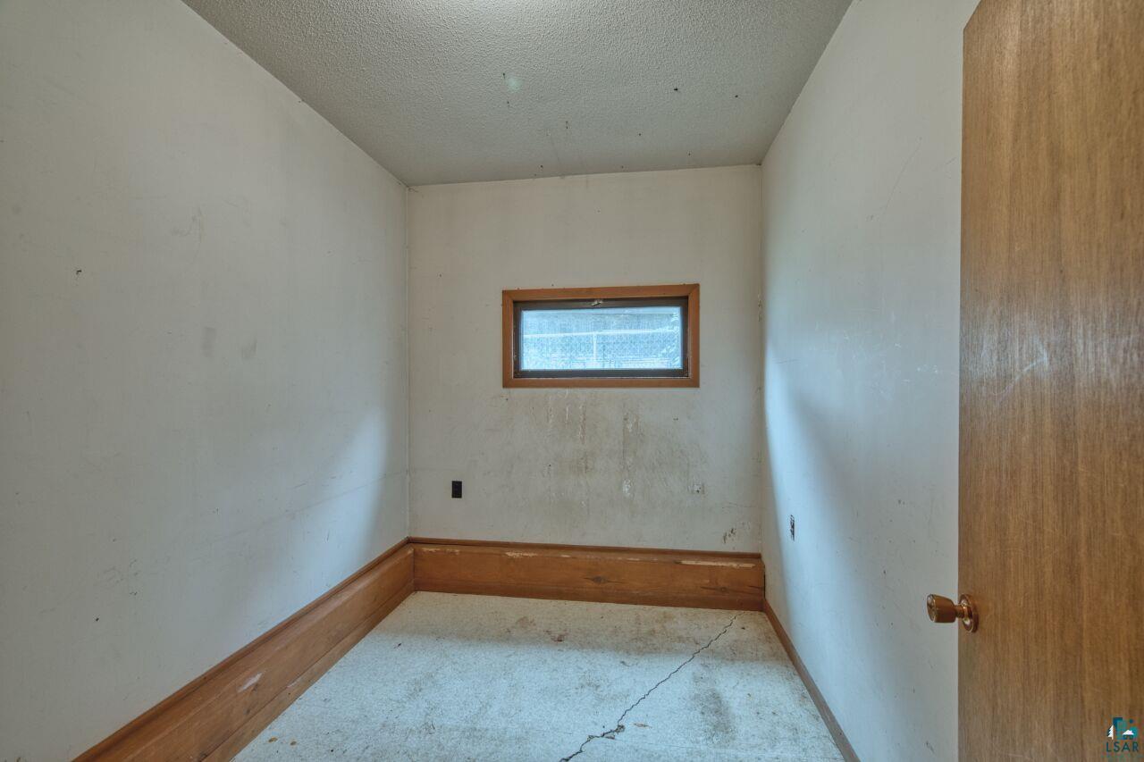 3360 North Leighton Road Hibbing, MN 55746 - Photo 37 of 60 Spare room with a textured ceiling and baseboards