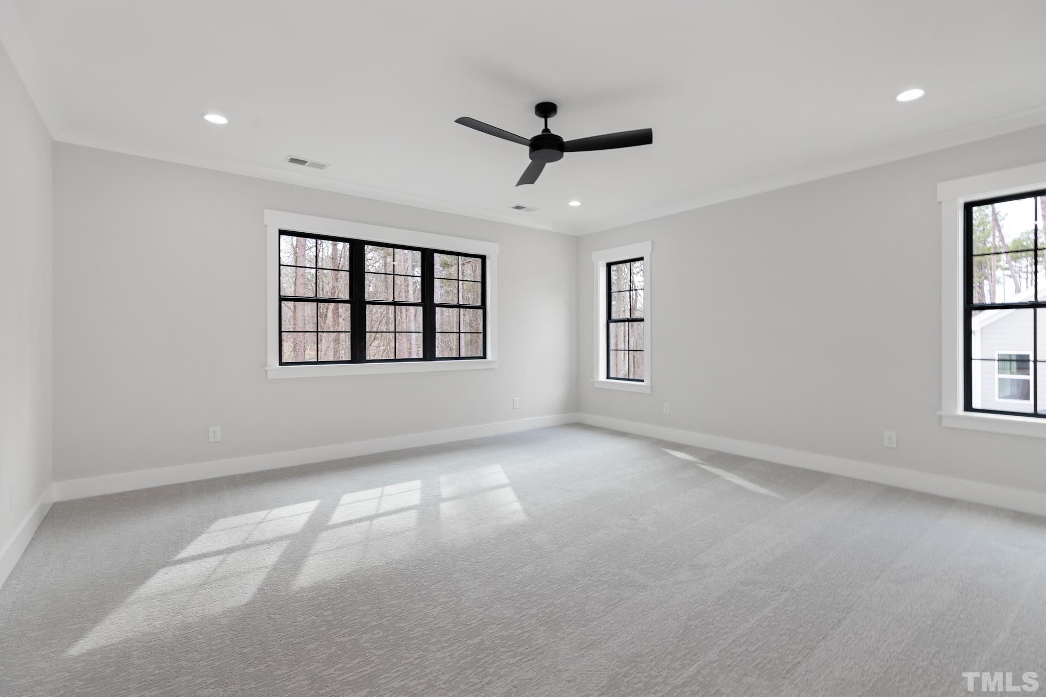 940 Harrison Ridge Road Wake Forest, NC 27587 - Photo 12 of 30 a view of empty room with windows