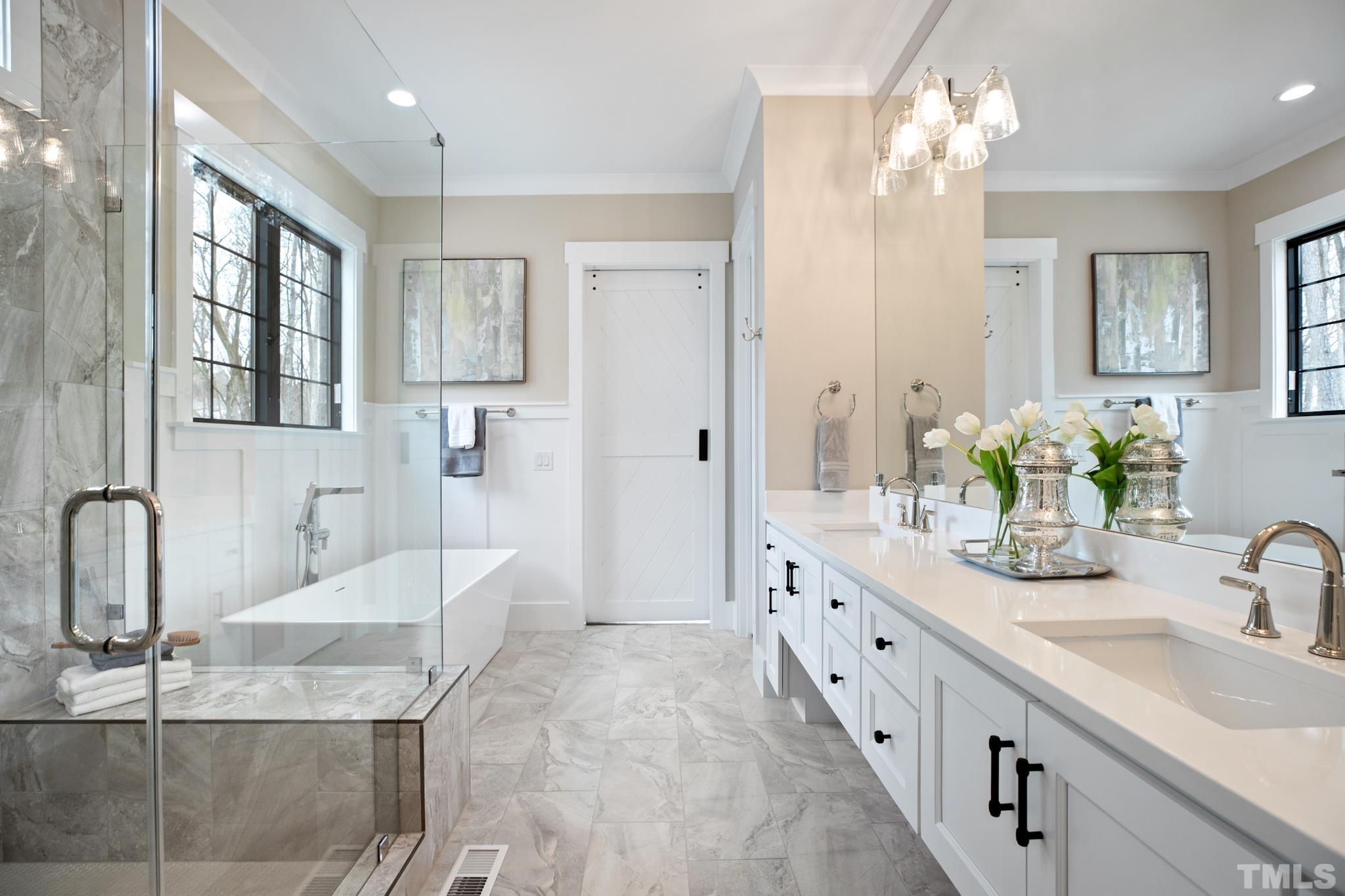 940 Harrison Ridge Road Wake Forest, NC 27587 - Photo 13 of 30 a spacious bathroom with double sink and a large mirror