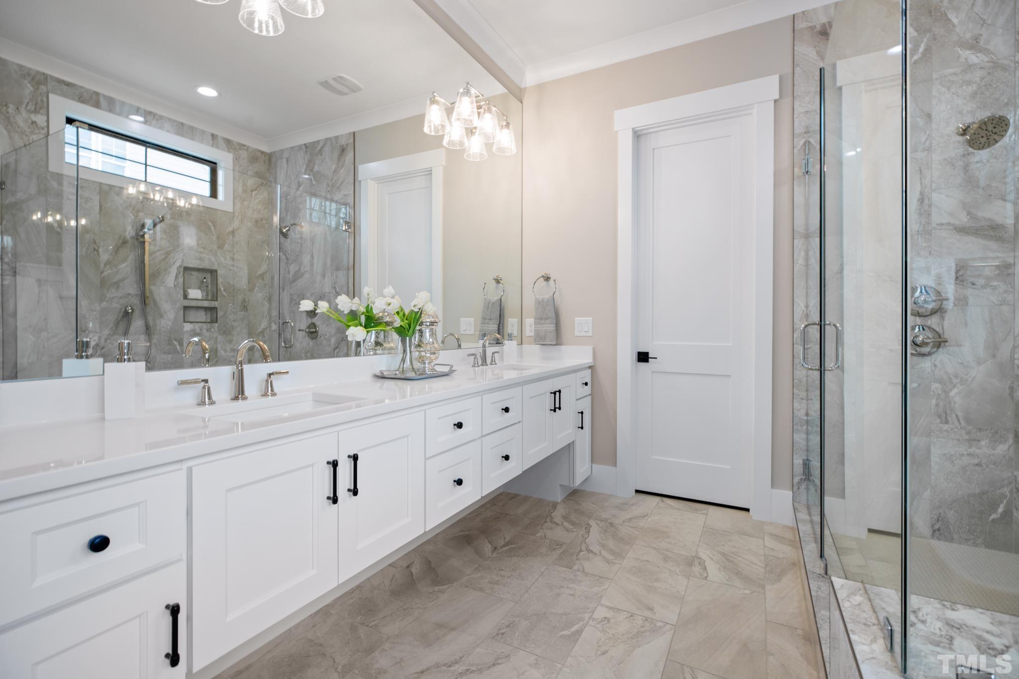 940 Harrison Ridge Road Wake Forest, NC 27587 - Photo 15 of 30 a bathroom with a double vanity sink mirror and shower