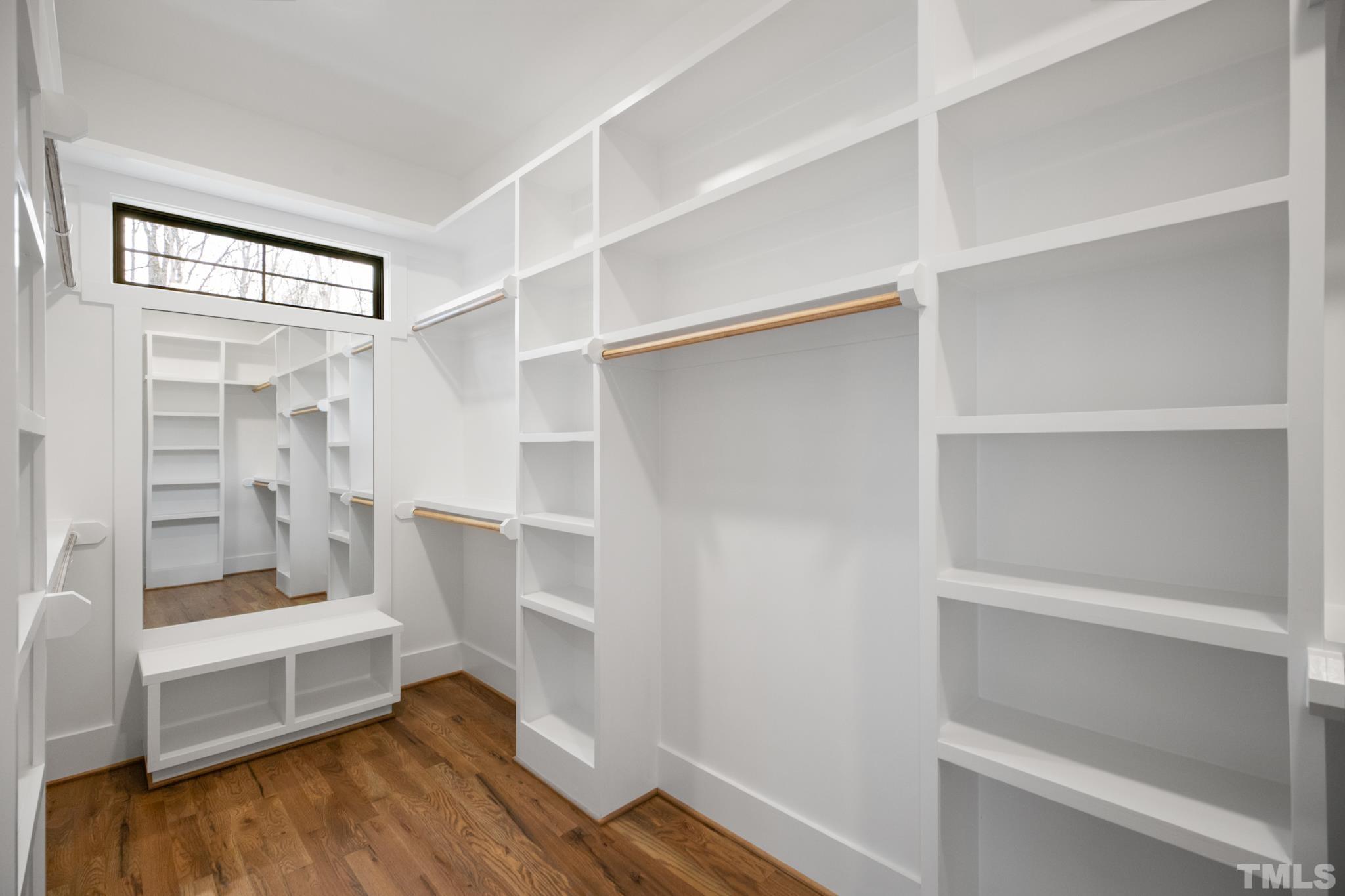 940 Harrison Ridge Road Wake Forest, NC 27587 - Photo 16 of 30 a view of walk in closet with empty racks