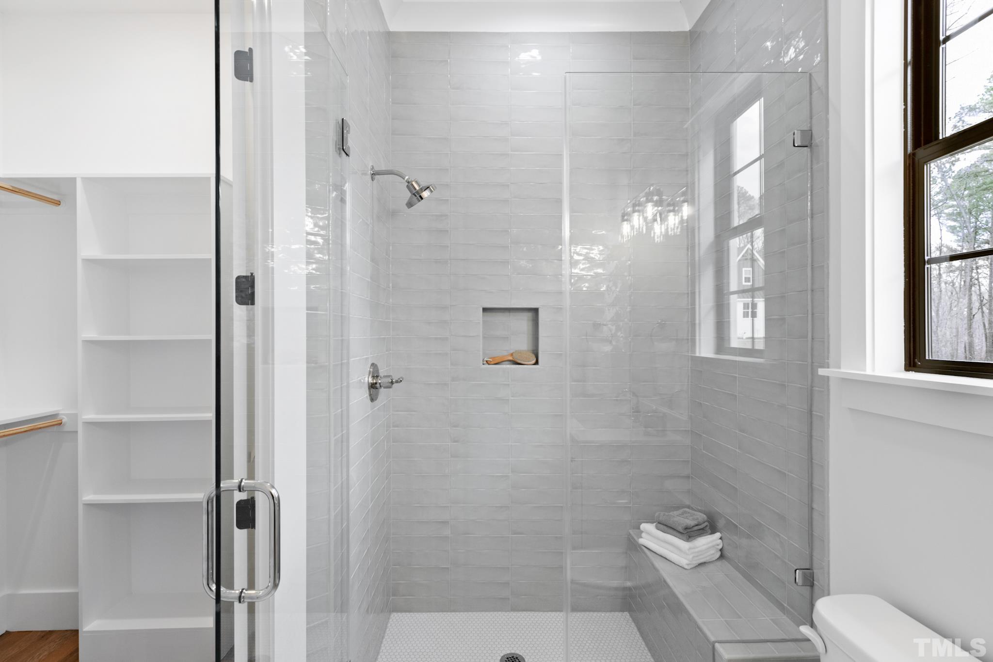 940 Harrison Ridge Road Wake Forest, NC 27587 - Photo 23 of 30 a bathroom with a shower and toilet