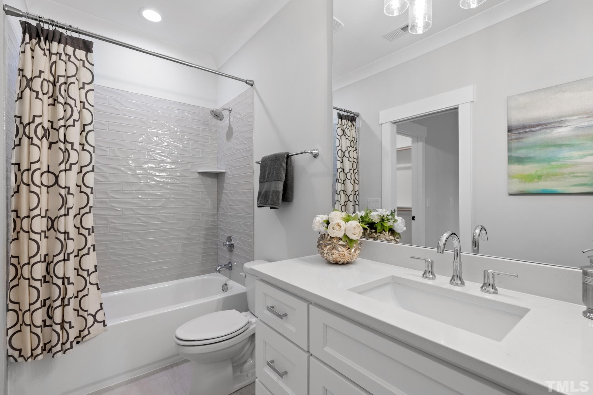 940 Harrison Ridge Road Wake Forest, NC 27587 - Photo 25 of 30 a bathroom with a sink a toilet and shower