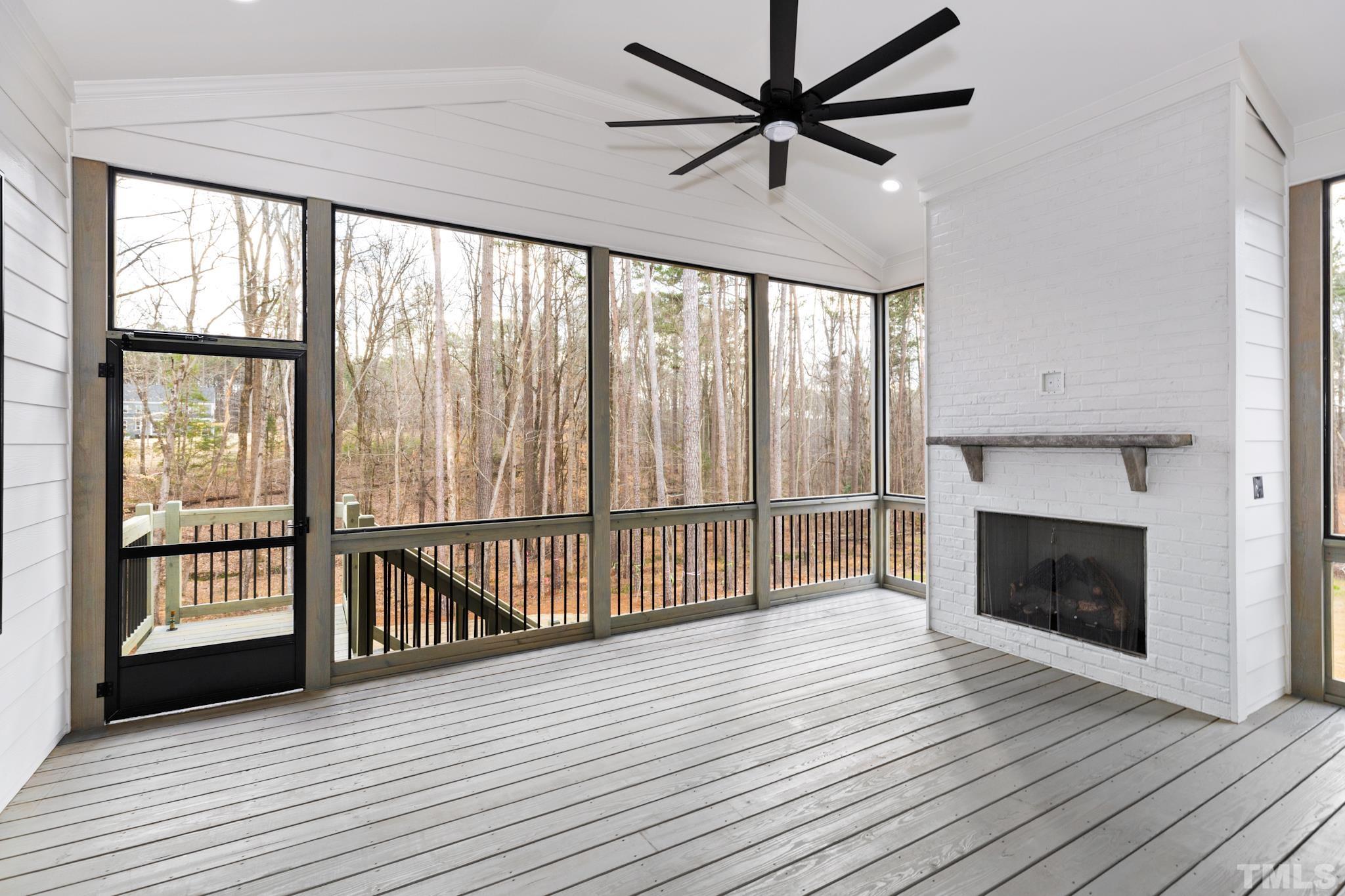 940 Harrison Ridge Road Wake Forest, NC 27587 - Photo 28 of 30 a view of a livingroom with wooden floor a ceiling fan and window