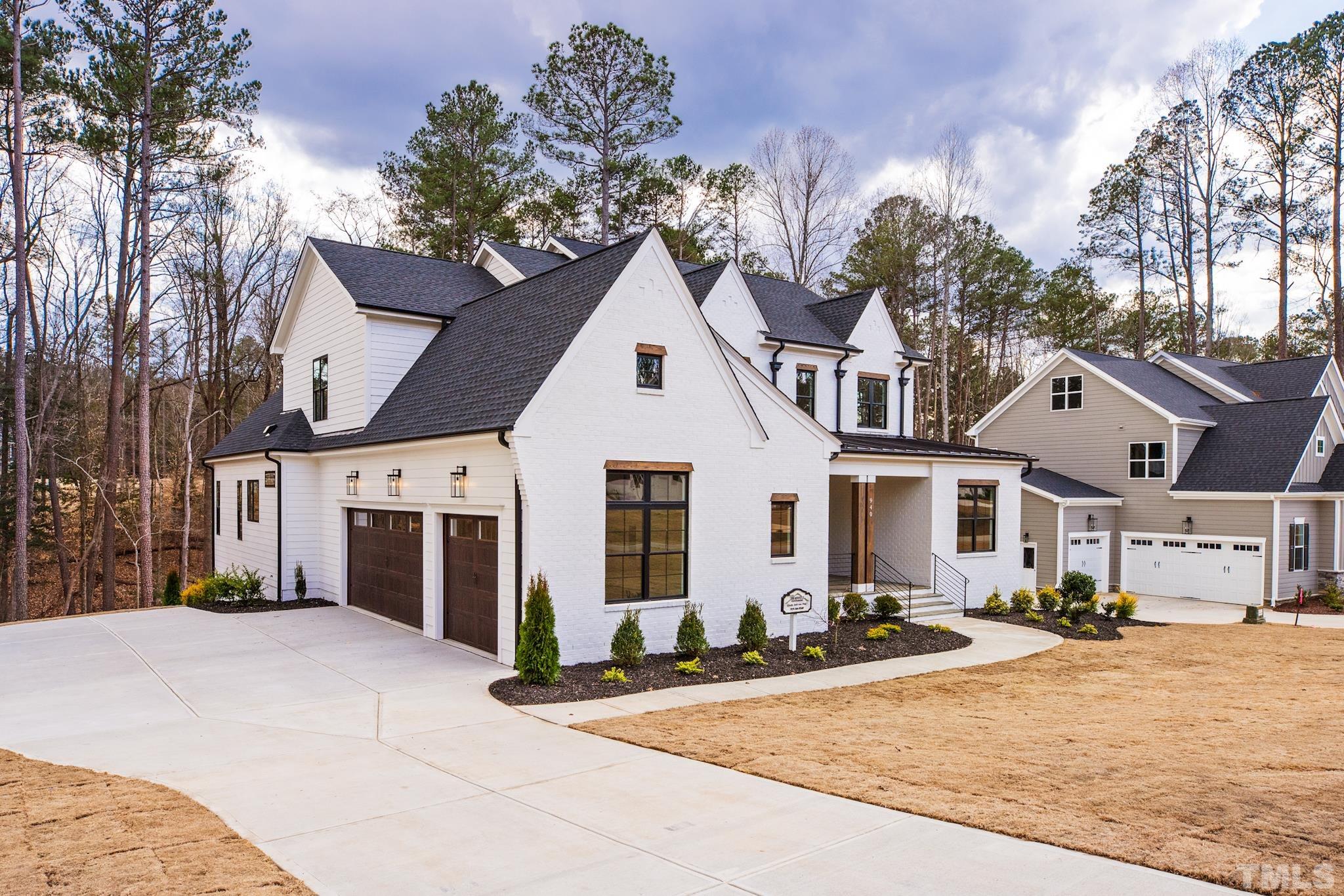 940 Harrison Ridge Road Wake Forest, NC 27587 - Photo 29 of 30 a view of a white house with a outdoor space