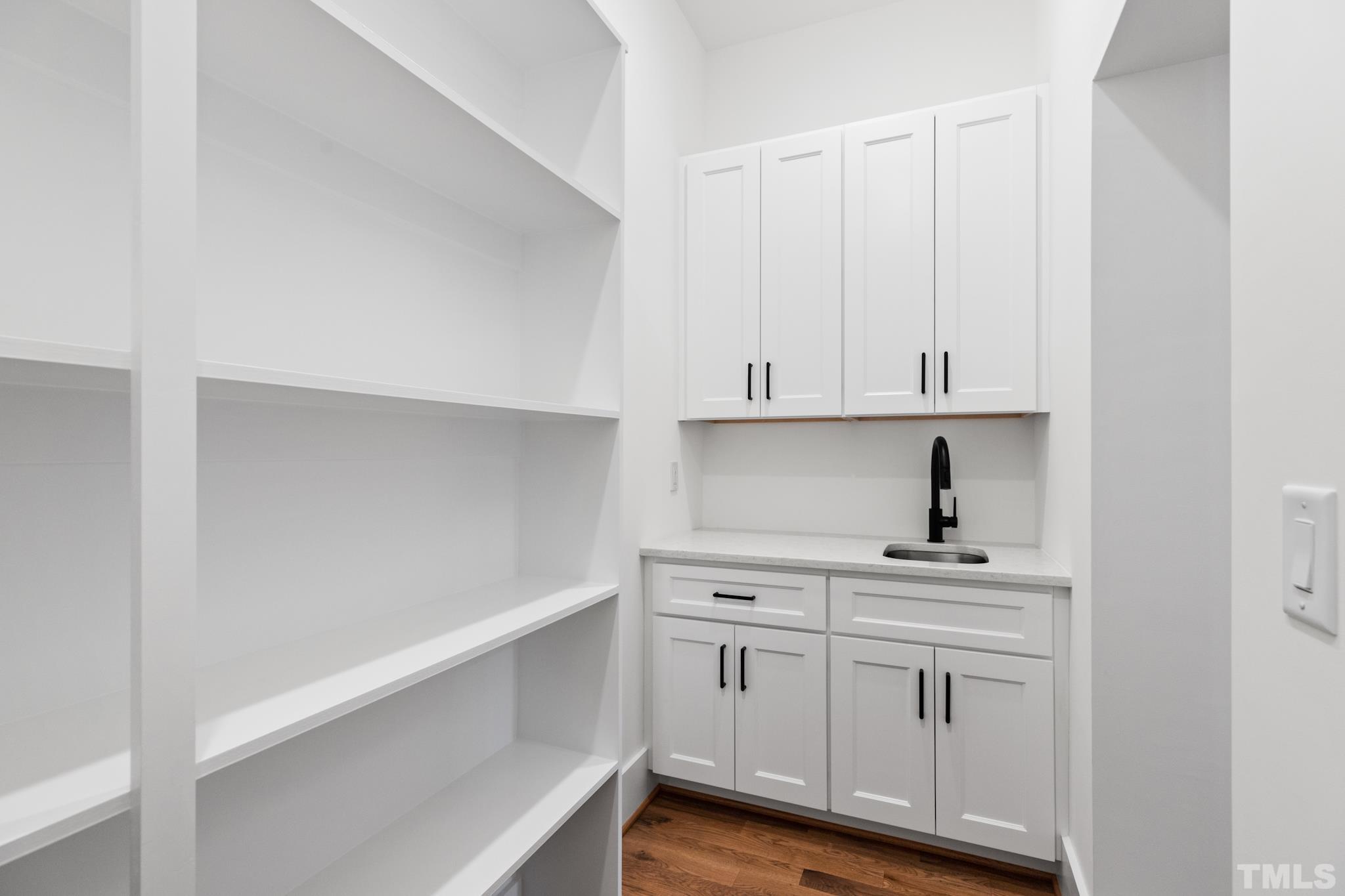 940 Harrison Ridge Road Wake Forest, NC 27587 - Photo 5 of 30 a view of cabinets and wooden floor