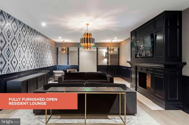 a kitchen with stainless steel appliances kitchen island granite countertop a stove a sink and a microwave