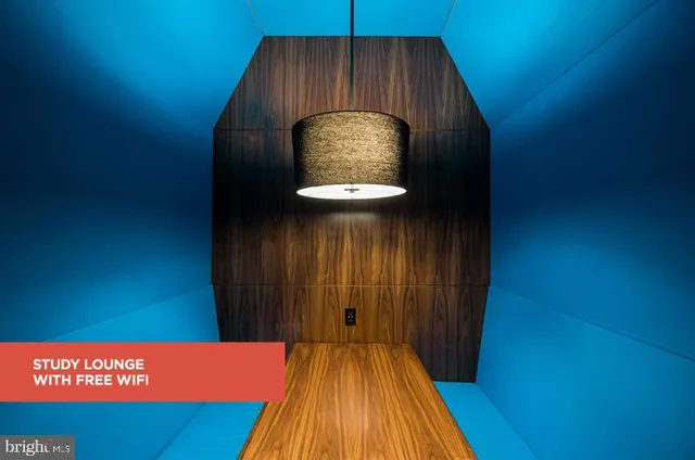 a view of a livingroom with furniture and a chandelier