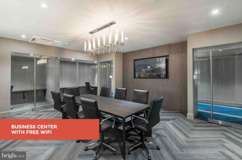 200 North 16th Street, Unit 724 Philadelphia, PA 19102 - Photo 17 of 31 a view of a livingroom with furniture and a chandelier