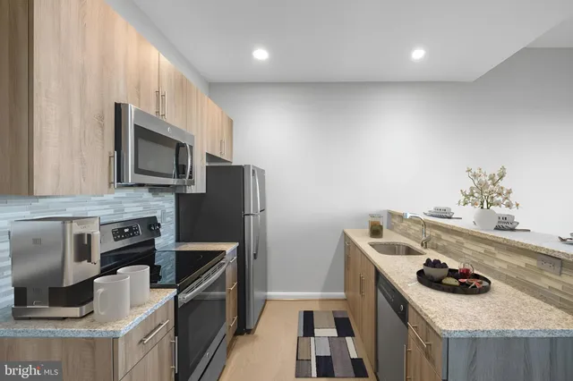 a kitchen with a stove and a microwave