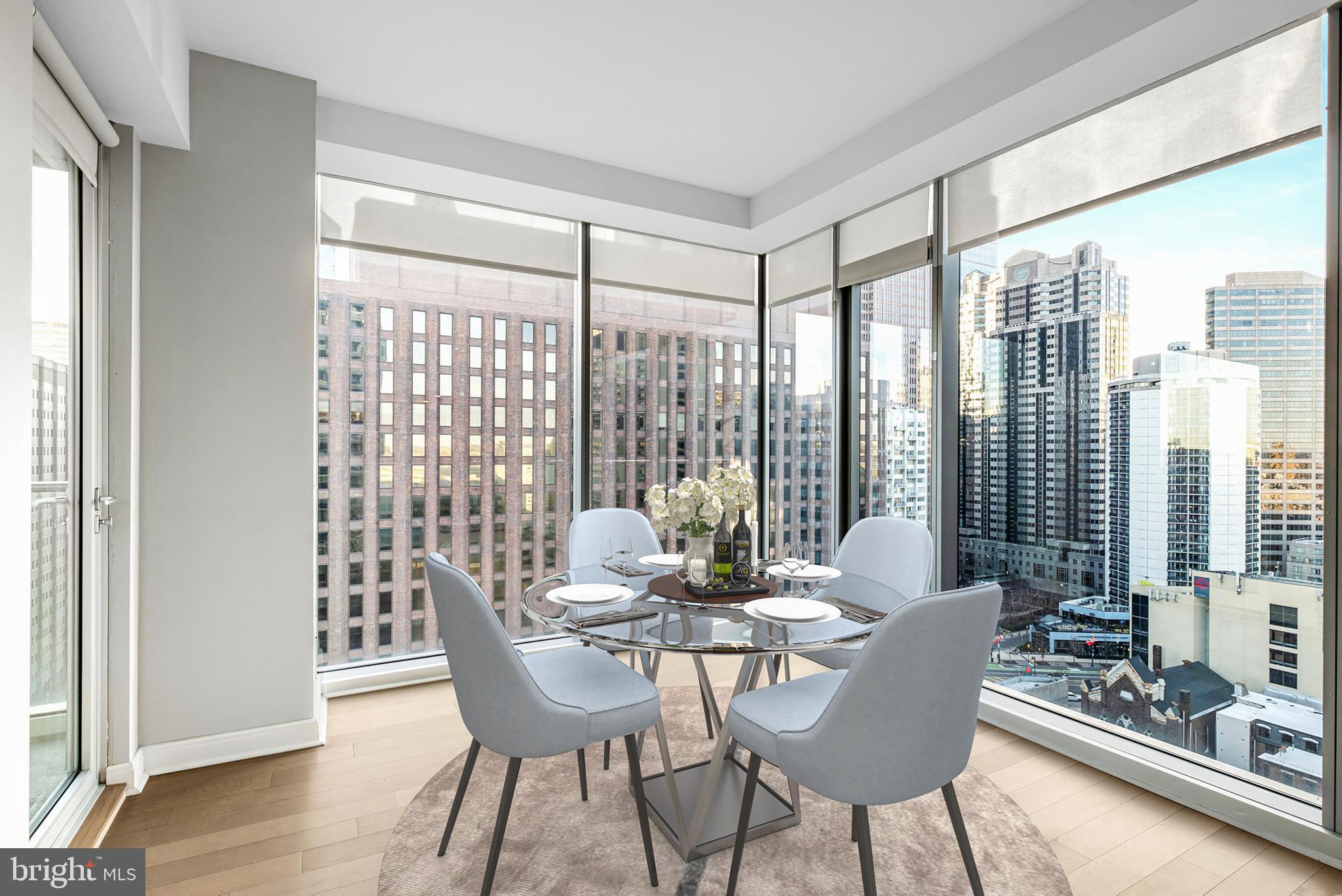 200 North 16th Street, Unit 724 Philadelphia, PA 19102 - Photo 4 of 31 a view of a dining room with furniture window and wooden floor
