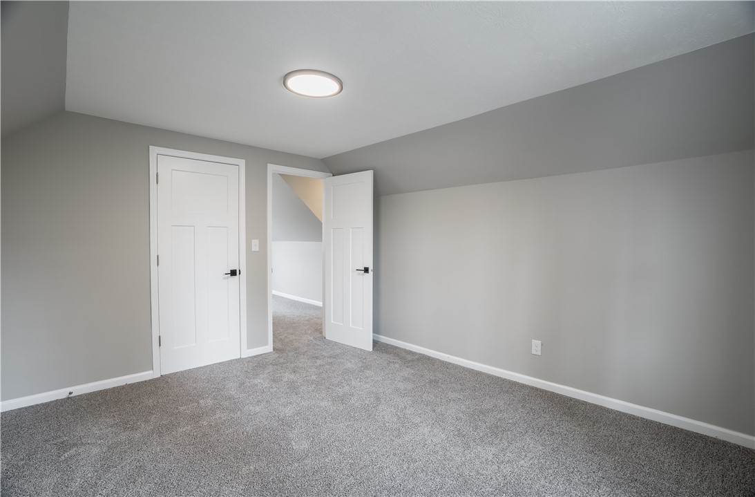 8240 Looney Road Piqua, OH 45356 - Photo 26 of 49 This spacious room features cozy carpeting and convenient entryways.