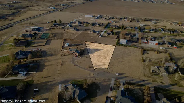 an aerial view of a house with parking space