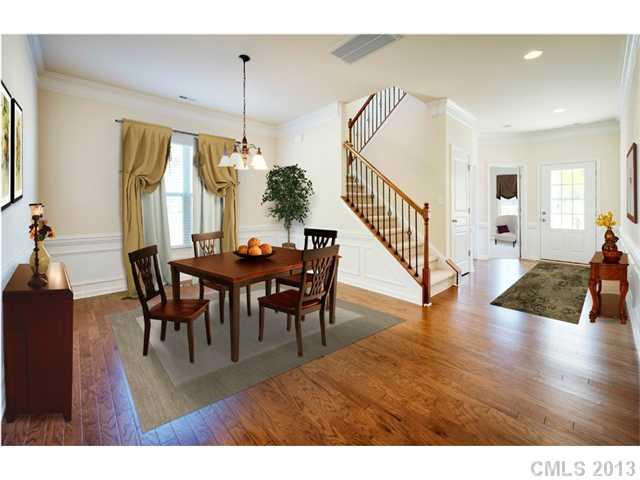 1437 Ridgehaven Road, Unit 160 Waxhaw, NC 28173 - Photo 4 of 10 a view of a dining room with furniture and wooden floor
